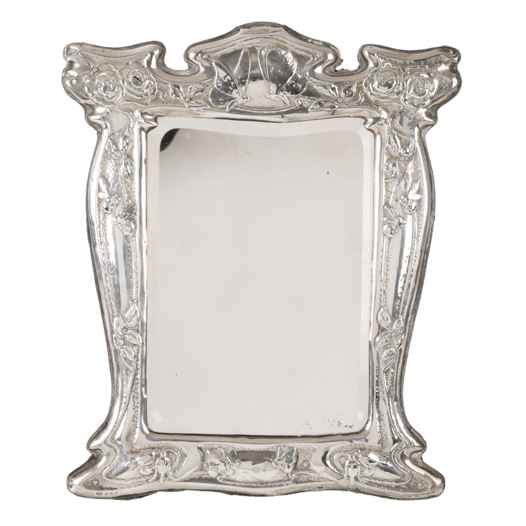 Art Nouveau silver mounted mirror.