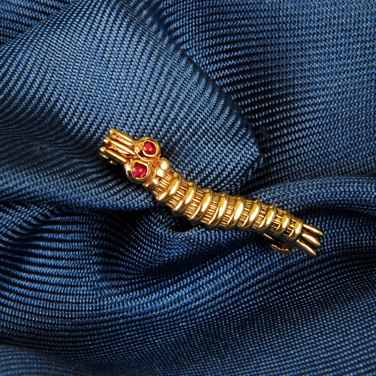 A caterpillar club brooch 