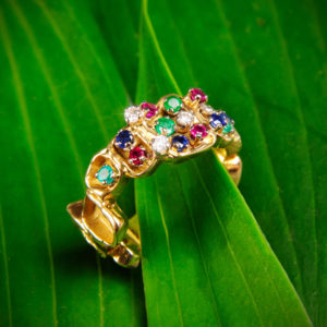 a 1970s 18ct gold diamond, emerald, sapphire and ruby ring