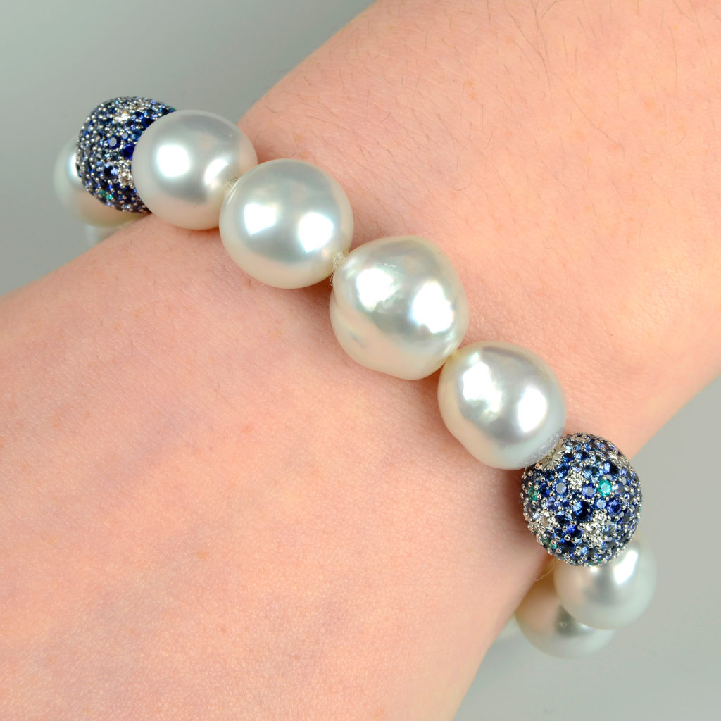 An 18ct gold South Sea baroque cultured pearl, diamond, sapphire and paraiba tourmaline 'Midnight Sky' bracelet, by Mikimoto.