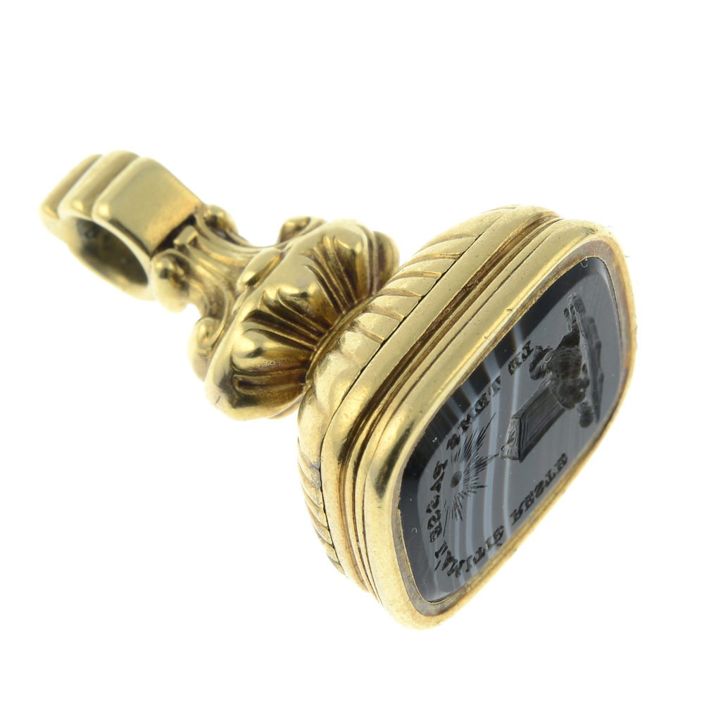 A late Georgian/William IV 15ct gold banded agate mourning fob, with hinged glazed compartment for Arthur Tyrwhitt Drake