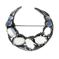 An Arts & Crafts silver moonstone crescent moon brooch, by Bernard Instone.