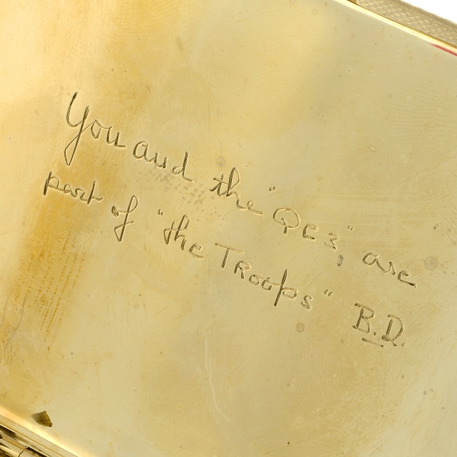 Bette Davis inscribed a cigarette case 'You and the "QE3" are part of "the Troops" B.D.'.