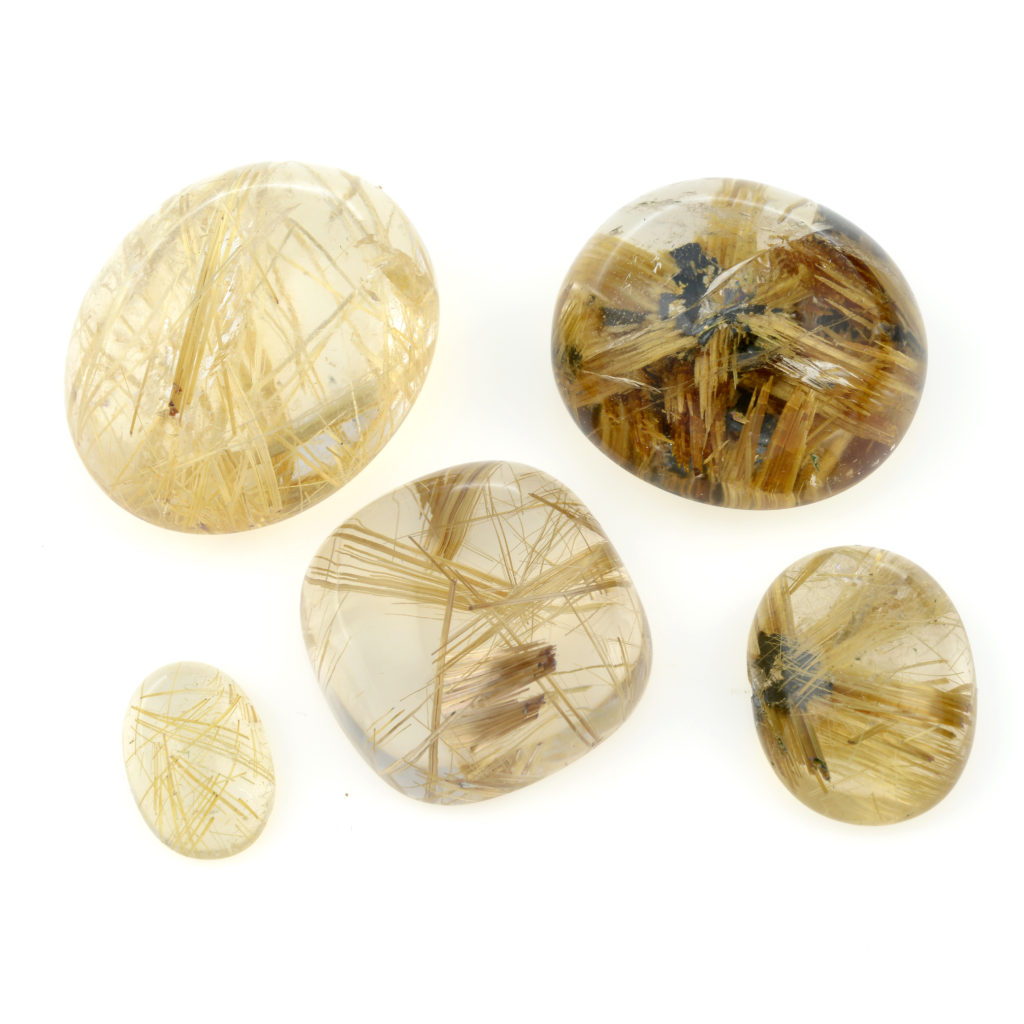 A selection of oval-shape rutilated quartz cabochons