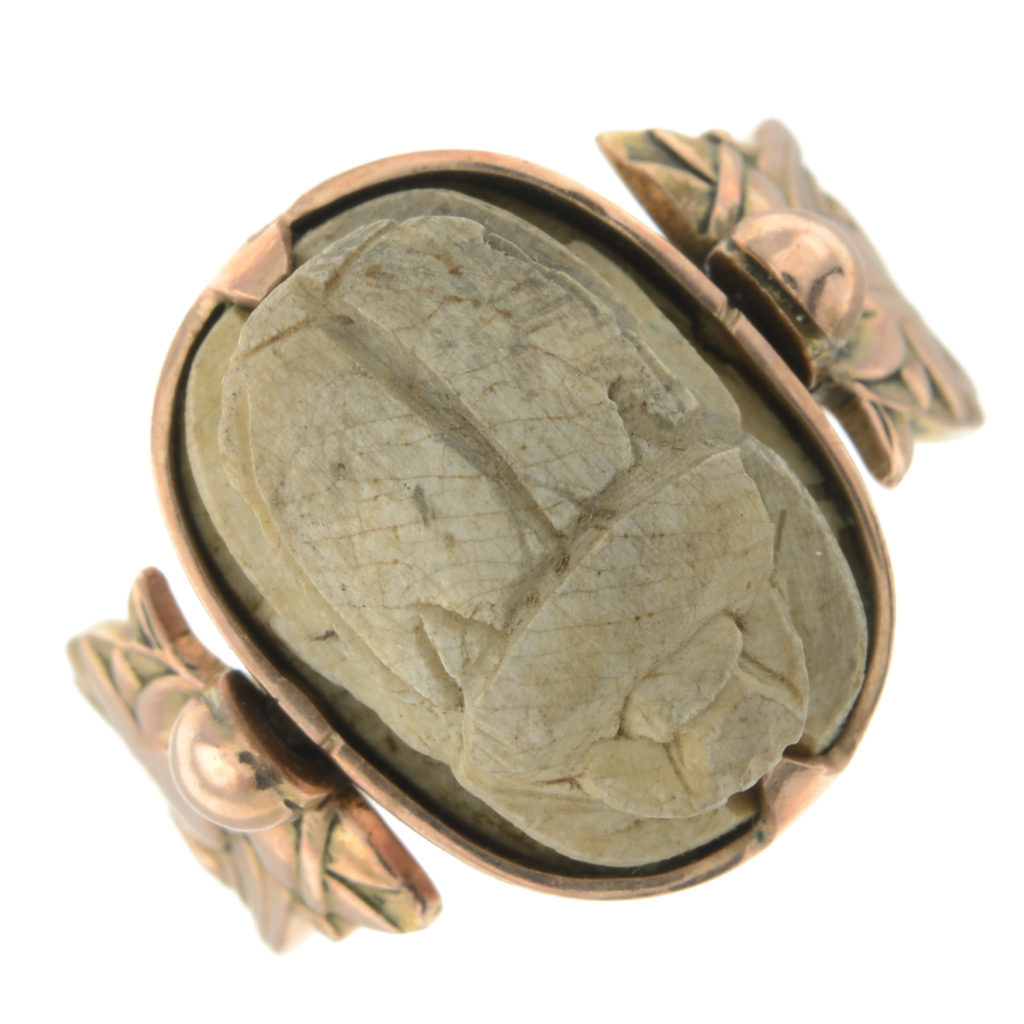 A Victorian carved gem-set scarab beetle swivel ring.