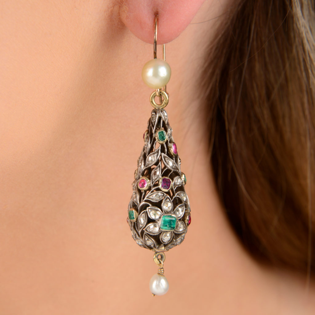 A pair of Indian mid 19th century silver and gold, rose-cut diamond, ruby and emerald pierced foliate earrings