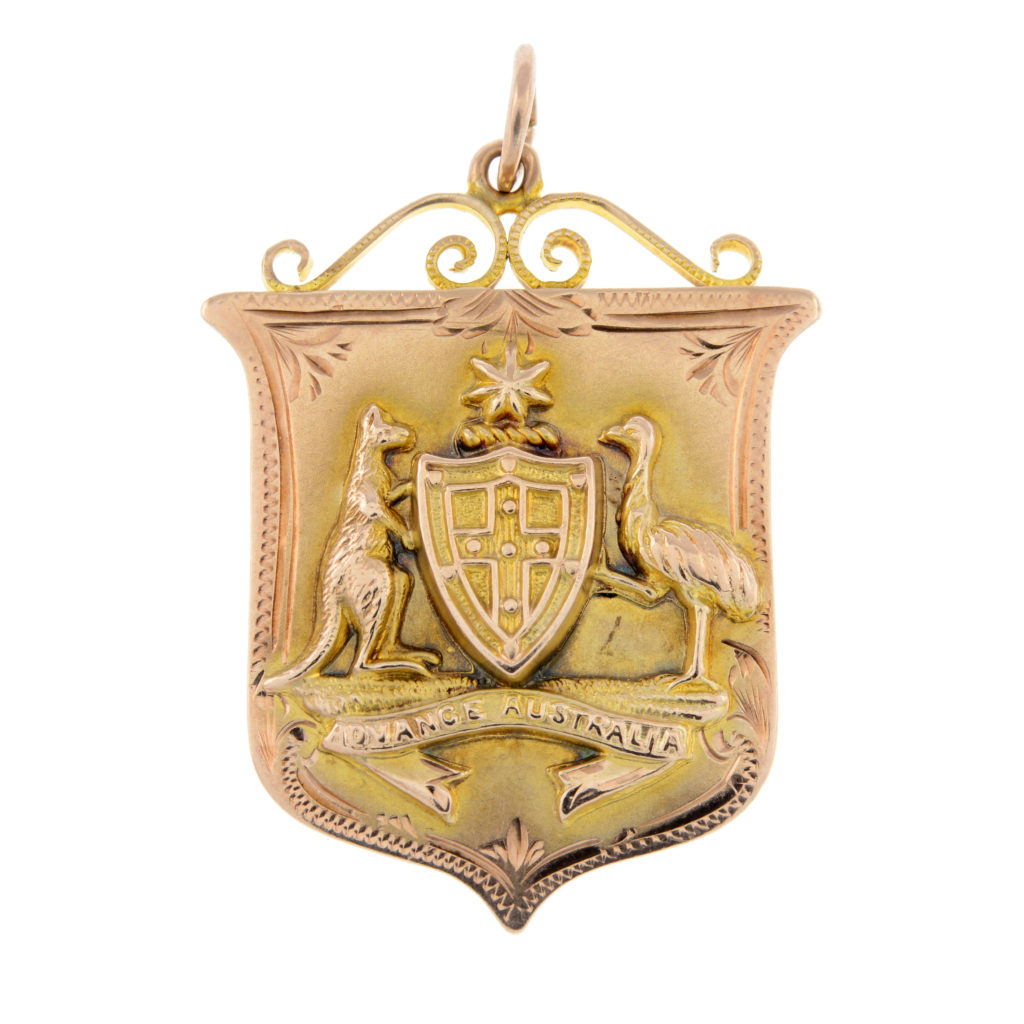 An early 20th century 9ct gold 'Advance Australia' pendant.